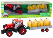 Traktor rolniczy z przyczepą i balami siana napęd