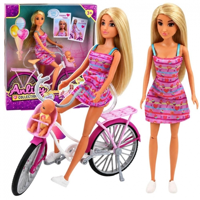 <img src='https://webimage.pl/pics/218/4/d5907990204218.jpg' style='height:440px' /> Lalka Anlily z rowerem i dzieckiem