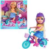 Lalka dziewczynka z kaskiem na rowerze