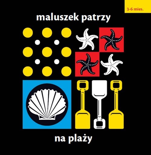 Maluszek patrzy Na plaży