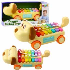 Piesek jeżdżący z cymbałkami