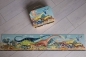 Puzzle panoramiczne w walizce 100: Dinozaury (J05831)