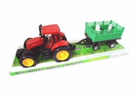 Traktor ze zwierzętami na przyczepie