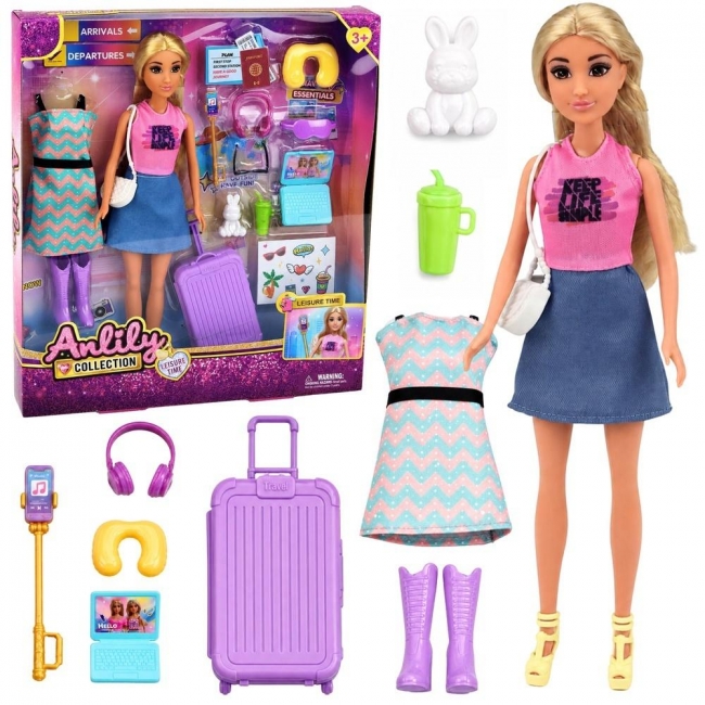 <img src='https://webimage.pl/pics/607/4/d5907990204607.jpg' style='height:440px' /> Lalka Anlily Podróżniczka z walizką akcesoria