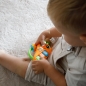 Carotina Baby - Zabawka elektroniczna z grzechotką Carotina