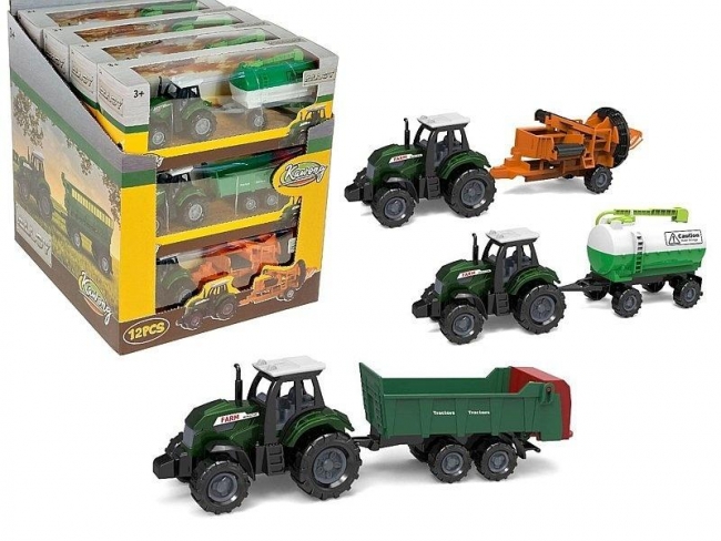 Traktor metalowy z maszyną rolniczą